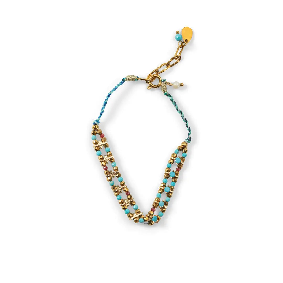 A delicate beaded necklace with turquoise blue beads, gold spacer rings, and small pink beads, featuring a gold clasp and a small round yellow charm, shown on a plain white background.